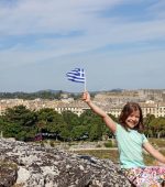 happy little girl greek flag corfu town greece little girl greek flag corfu town greece 112551076